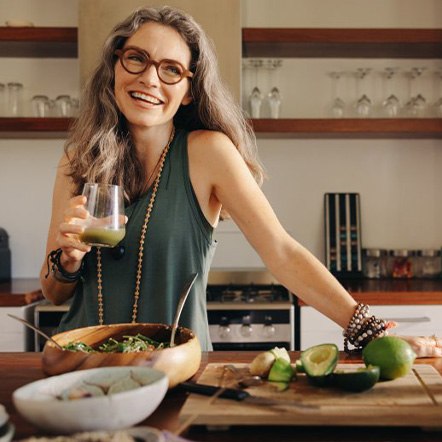 Woman smiling after making a healthy meal