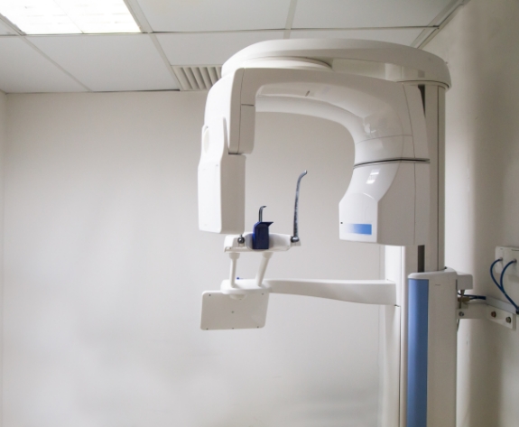 3 D cone beam scanner against white wall of dental office