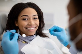 Young woman smiling during dental appointment