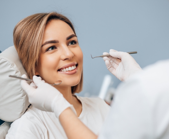 Woman smiling during preventive dentistry checkup