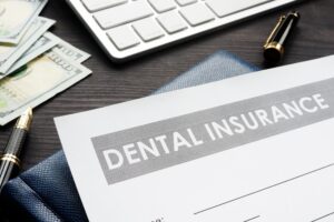 Dental insurance form on messy desk